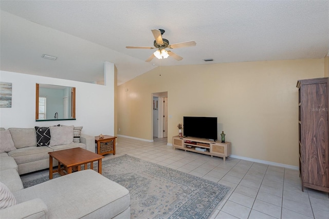 tiled living room with ceiling fan, a textured ceiling, and lofted ceiling