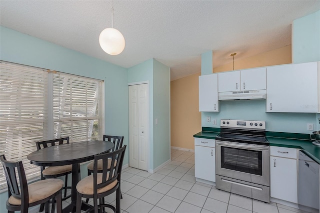 kitchen with stainless steel range with electric stovetop, white cabinetry, decorative light fixtures, light tile patterned flooring, and vaulted ceiling