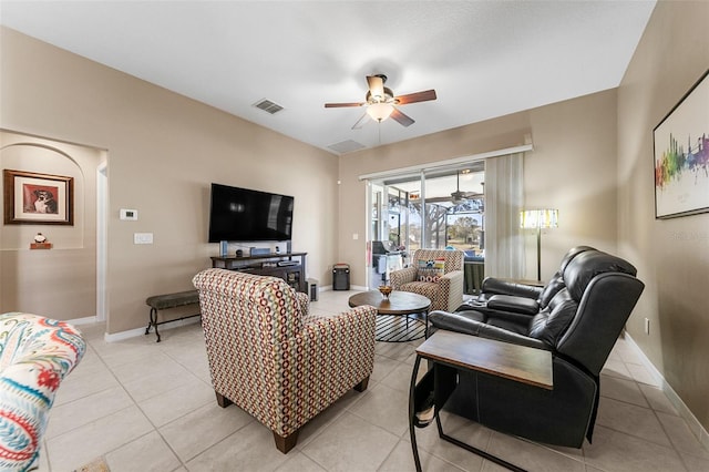 tiled living room featuring ceiling fan