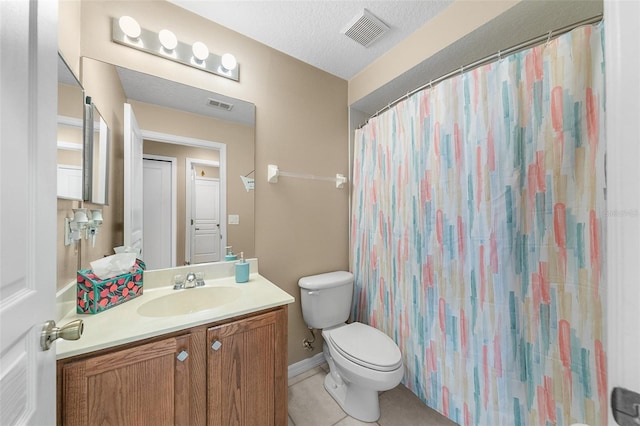 bathroom featuring walk in shower, tile patterned floors, toilet, a textured ceiling, and vanity