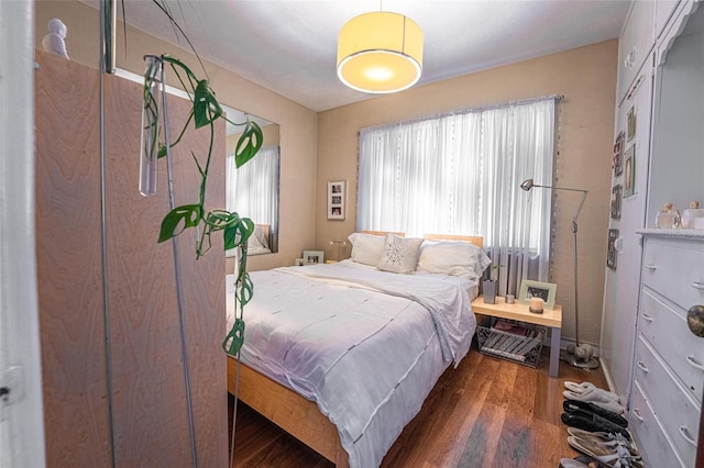 bedroom featuring dark hardwood / wood-style flooring