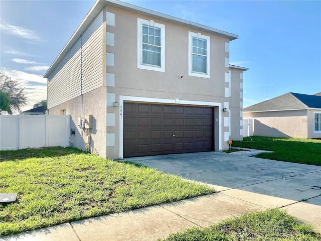 view of property exterior with a lawn and a garage