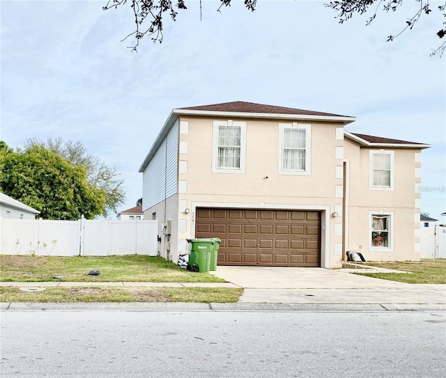 view of front of home with a garage and a front yard