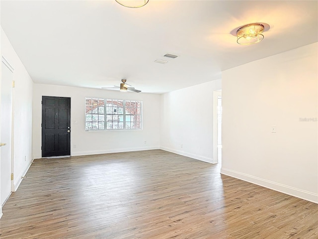 930 Lewis Dr, Daytona Beach, FL 32117 - interior space featuring visible vents, baseboards, a ceiling fan, and wood finished floors