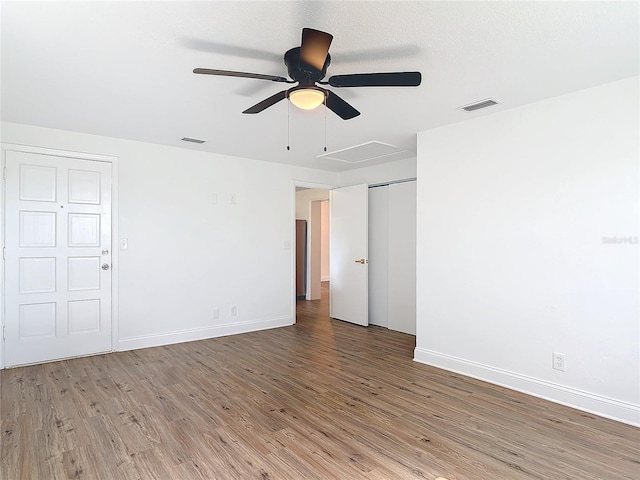 930 Lewis Dr, Daytona Beach, FL 32117 - empty room with wood finished floors, baseboards, and visible vents
