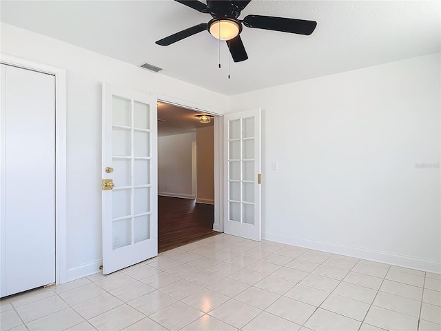 930 Lewis Dr, Daytona Beach, FL 32117 - empty room featuring french doors, ceiling fan, baseboards, and visible vents