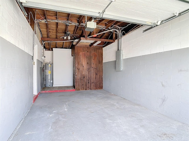 930 Lewis Dr, Daytona Beach, FL 32117 - garage with electric water heater, a garage door opener, concrete block wall, and electric panel