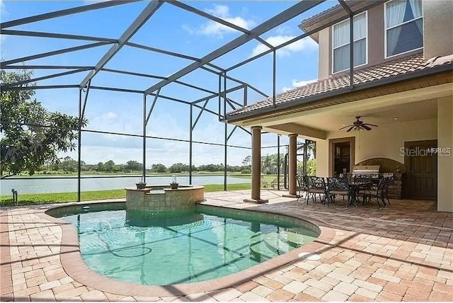 view of pool with ceiling fan, a lanai, a water view, and a patio area