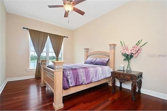 bedroom with ceiling fan and dark hardwood / wood-style flooring