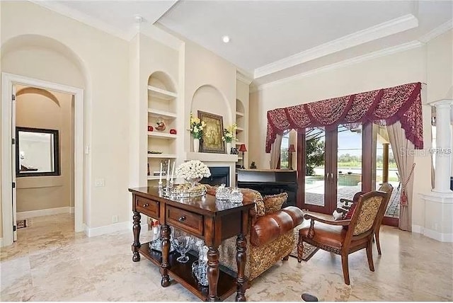 sitting room with ornate columns, built in features, ornamental molding, and french doors