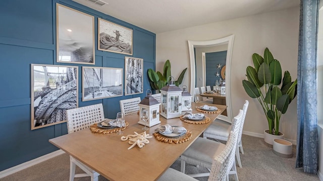 dining space featuring carpet flooring