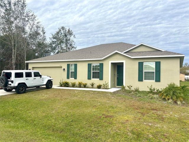 ranch-style home with a front lawn and a garage