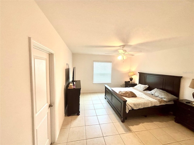 bedroom featuring ceiling fan and light tile patterned flooring