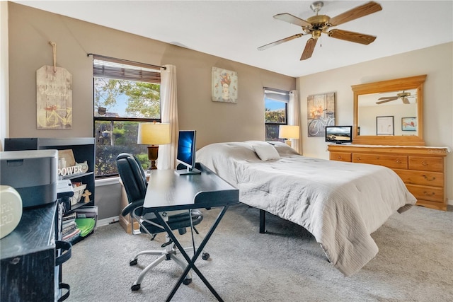 bedroom with ceiling fan and carpet floors