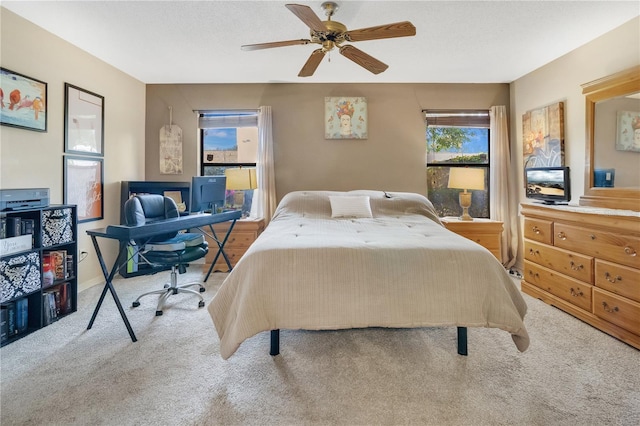 bedroom featuring ceiling fan and carpet floors