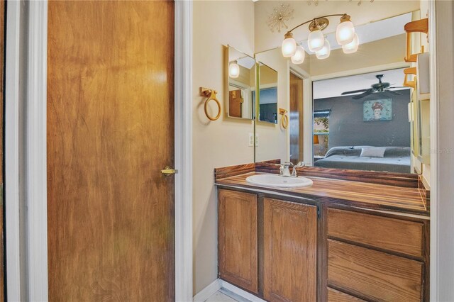 bathroom with ceiling fan and vanity