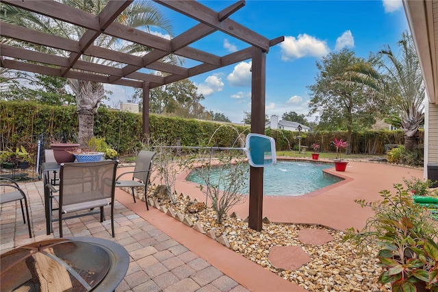 view of pool with a pergola, a patio area, and pool water feature