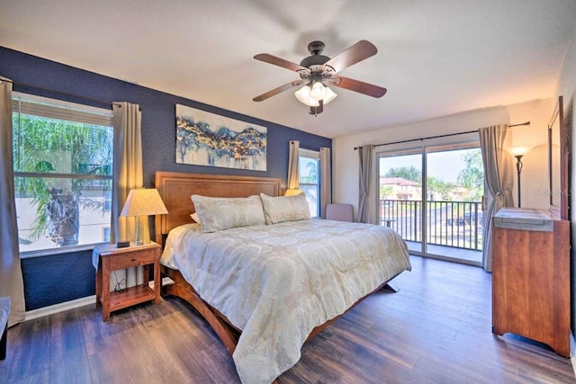 bedroom with ceiling fan, multiple windows, dark hardwood / wood-style flooring, and access to outside