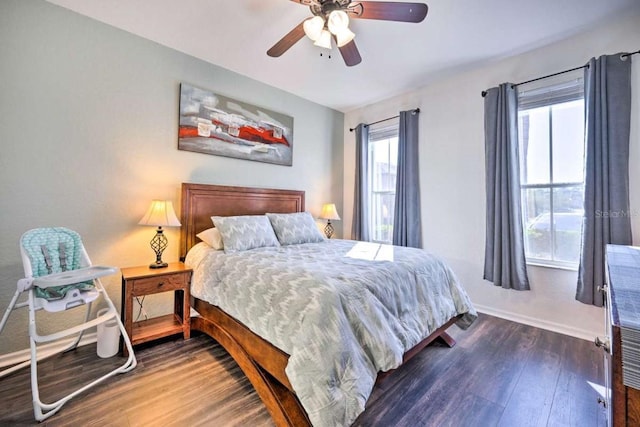 bedroom featuring ceiling fan and dark hardwood / wood-style flooring