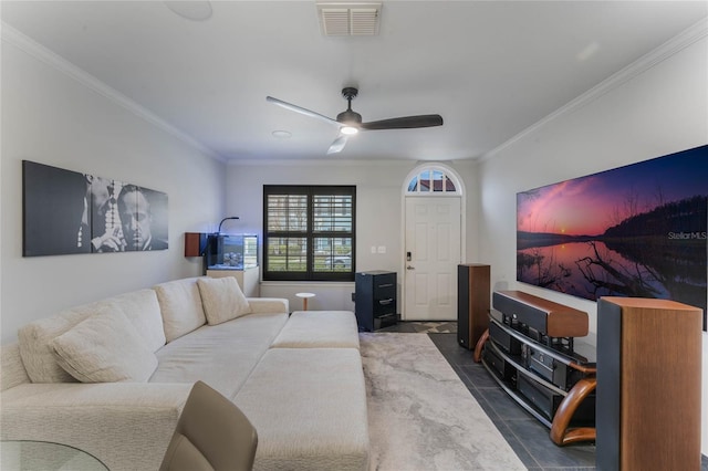 living room featuring ceiling fan and crown molding