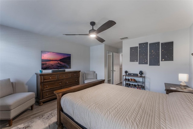 bedroom with ceiling fan and light hardwood / wood-style flooring