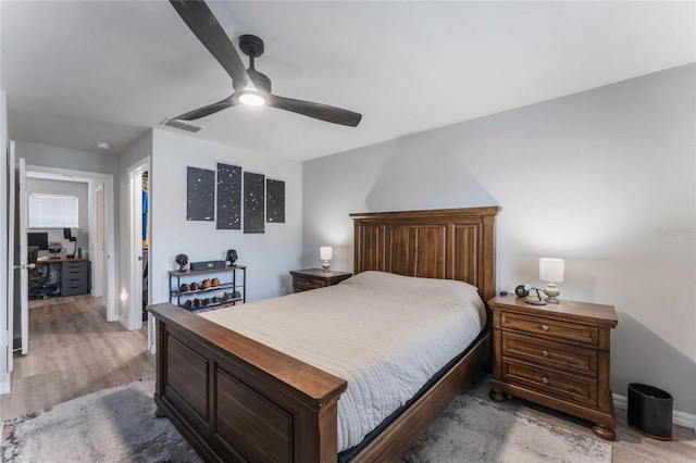 bedroom with ceiling fan and light hardwood / wood-style flooring