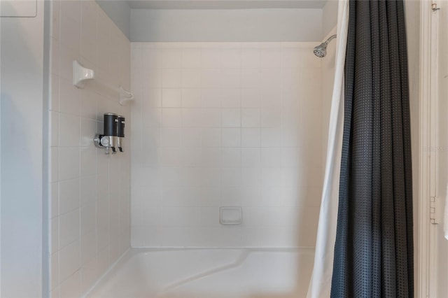 bathroom featuring shower / tub combo with curtain