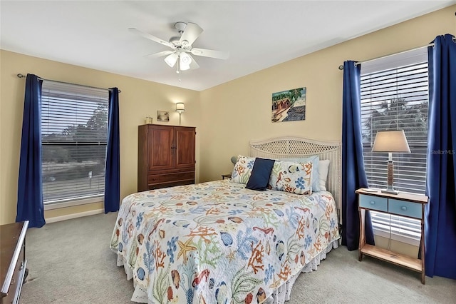 bedroom with light carpet and ceiling fan