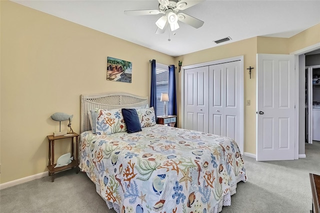 bedroom featuring ceiling fan, light colored carpet, and a closet