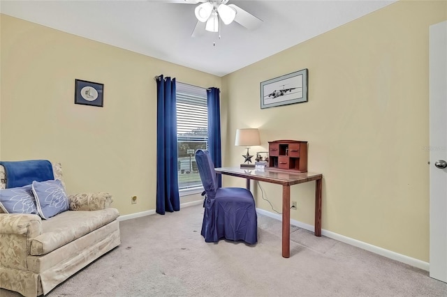 home office featuring ceiling fan and light colored carpet