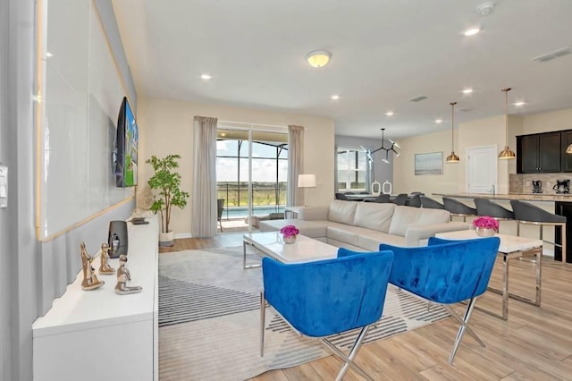 living room with light hardwood / wood-style flooring