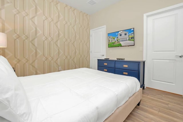 bedroom featuring wood-type flooring