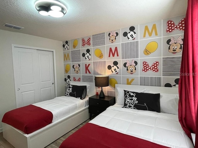 bedroom featuring a closet and a textured ceiling