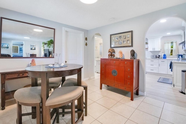 dining area with light tile patterned floors