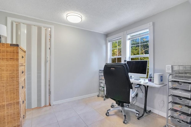 office area featuring light tile patterned flooring and a textured ceiling