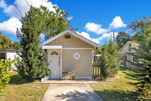 view of outbuilding featuring a yard