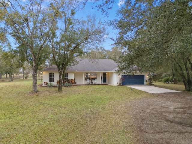 ranch-style home with a garage, a front lawn, and a porch