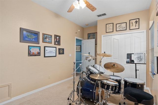 interior space with light colored carpet and ceiling fan