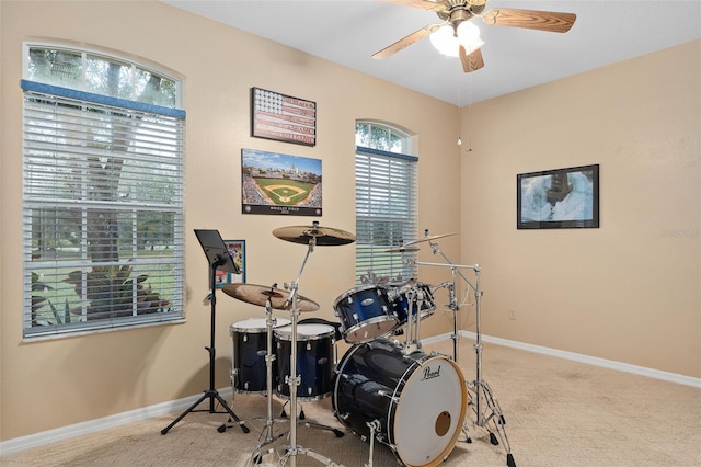 miscellaneous room with light colored carpet and ceiling fan