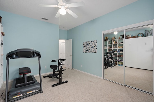 exercise room with carpet flooring and ceiling fan