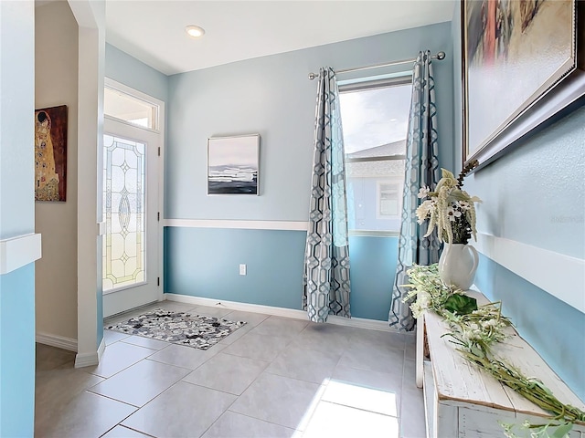 tiled foyer entrance featuring plenty of natural light