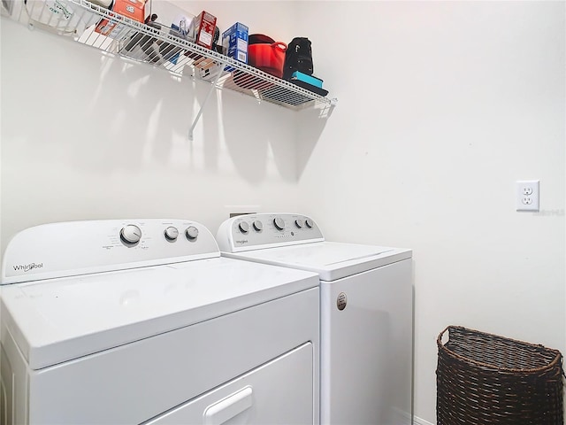 laundry area with separate washer and dryer