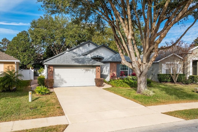 view of front of home with a front lawn and a garage