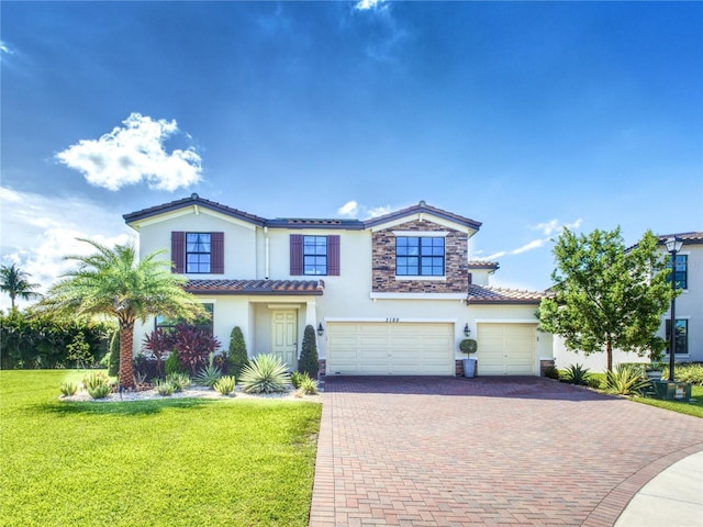 view of front facade featuring a garage and a front yard