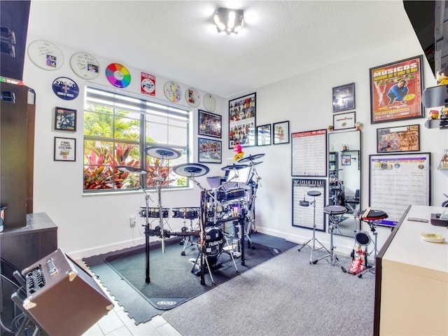 workout room with a textured ceiling