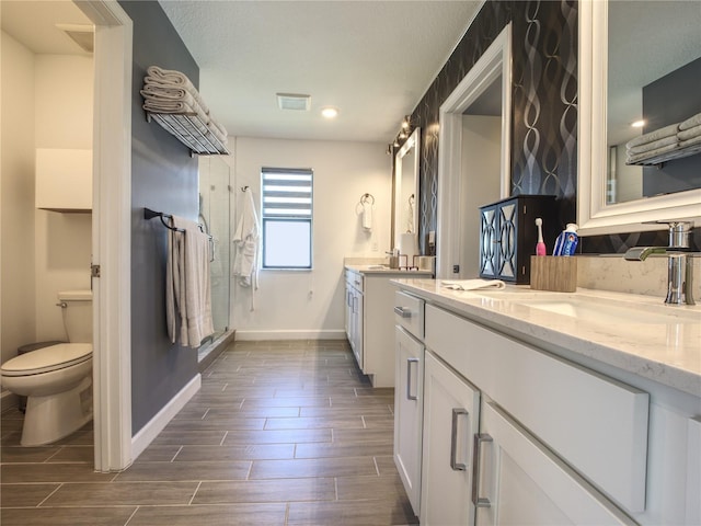 bathroom with toilet and vanity