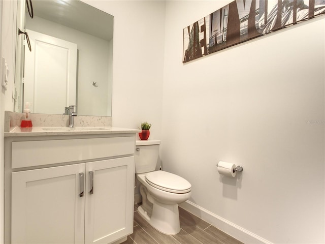 bathroom featuring toilet and vanity