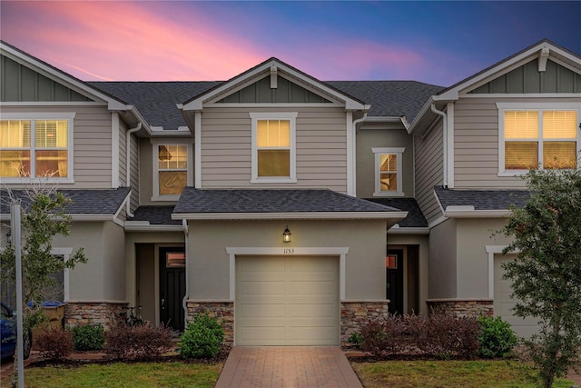 view of front of property with a garage