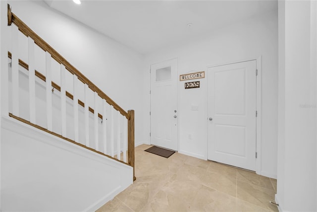 foyer entrance with light tile patterned flooring