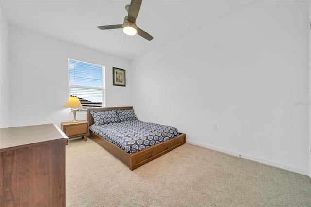 bedroom featuring ceiling fan and light carpet